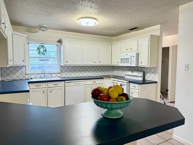 View of kitchen from wet bar.