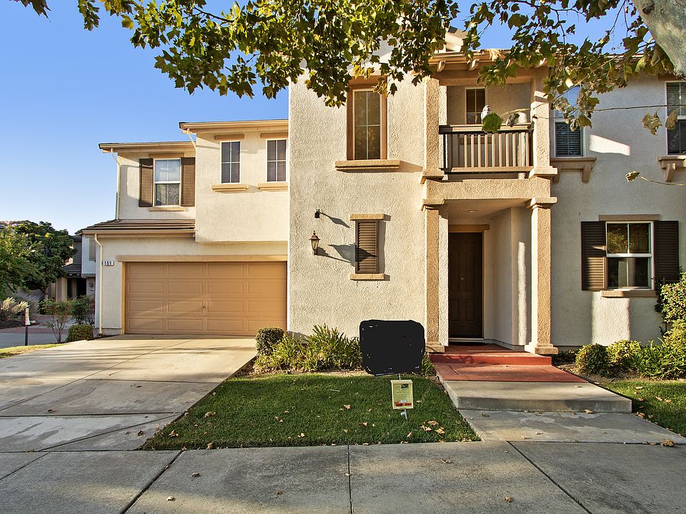 Home has private driveway and attached two car garage.