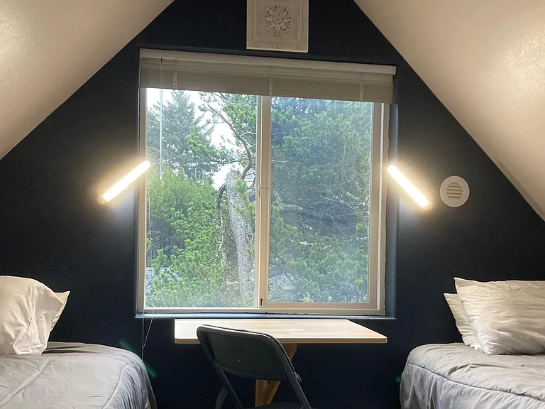 Flip up desk. This room only has one twin bed (not the two in this photo)