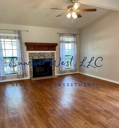 Woodburning fireplace, vaulted ceiling, vinyl plank floor