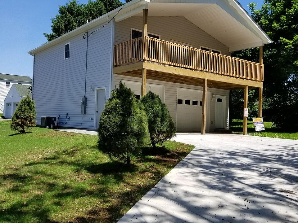Front from Shryock Ave, depicts expansive driveway and large