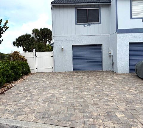 Updated driveway, walking pathways and backyard deck.
