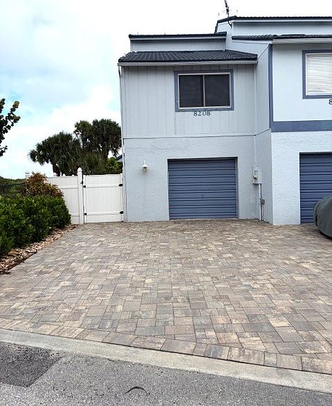 Updated driveway, walking pathways and backyard deck.