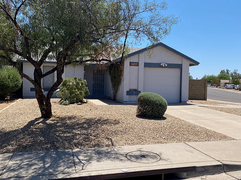 Cute Single Level Corner Property with Garage and Yard!
