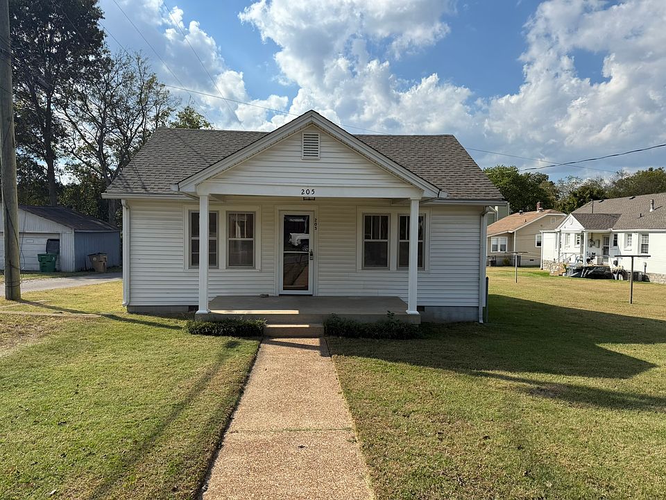Large front porch for watching the sunset and ample lawn space for grilling in the back of the home.