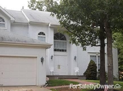 Embassy Model White Stucco Front