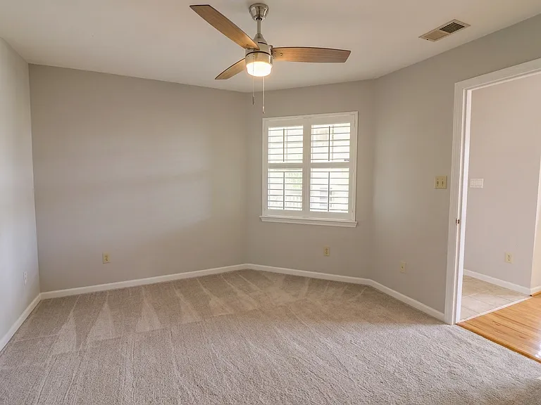 Primary bedroom with walk-in closet