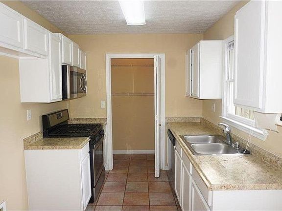 Stainless Steel refrigerator is included but not shown