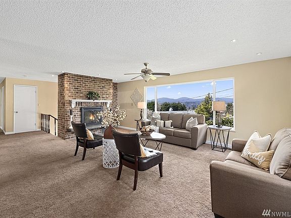 Western facing living room allows you to enjoy commanding views of the snow capped Olympic mountains on a clear day!