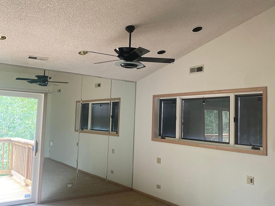 Master with walk-in closet, bathroom a and patio door to oversized deck