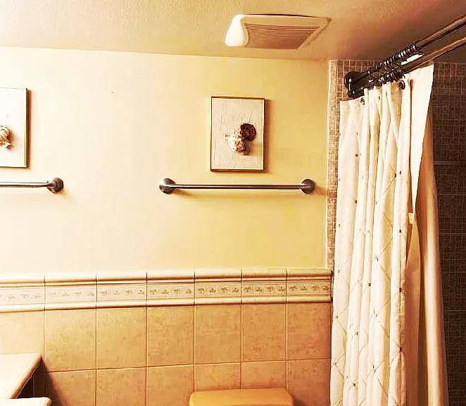 Master ensuite full bath (tub and shower). Heat lamp, Kohler fixtures., custom height toilet, cast iron tub with slip safety surface.