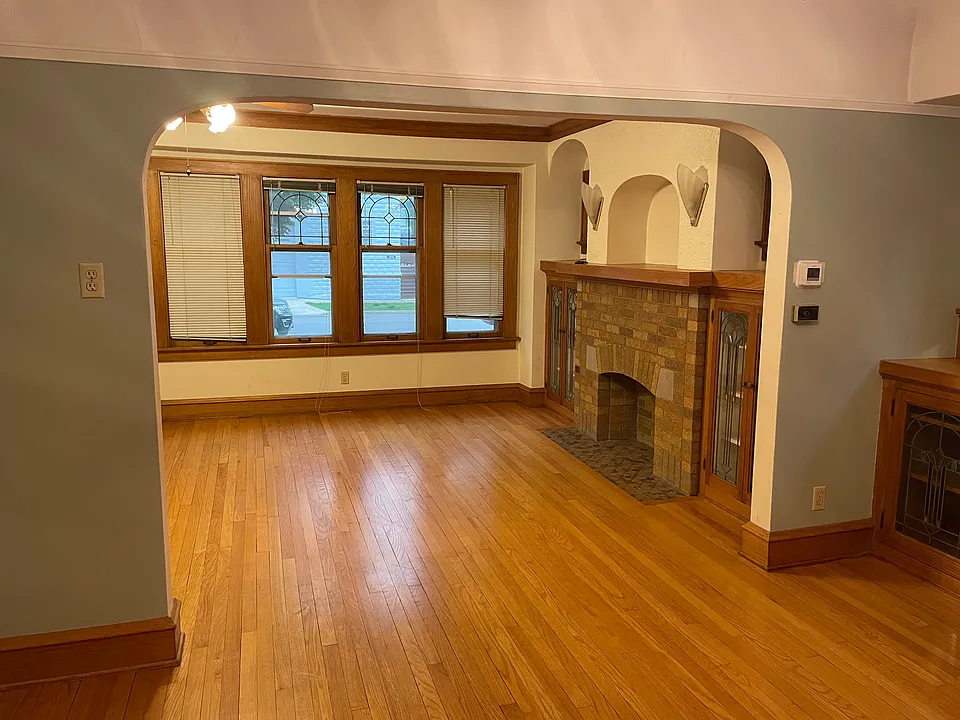 Living room with faux fireplace.