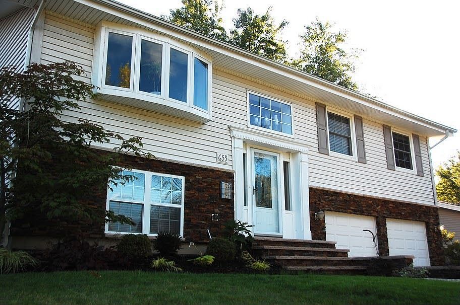 front with new stone work, and exterior hardscape