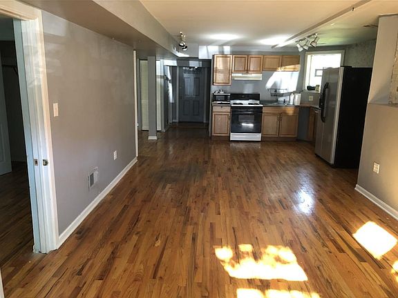 Looking east from living rm to kitchen (front bedroom on the left)
