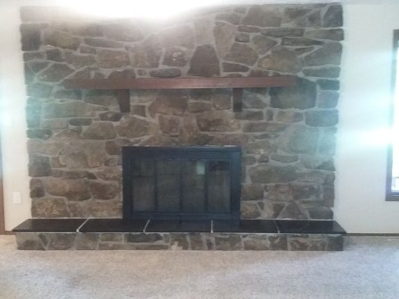 Den with gas fireplace