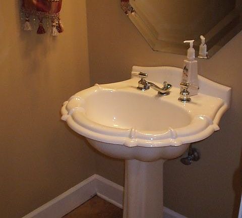 Half bath w/pedastal sink, new paint, tile floor