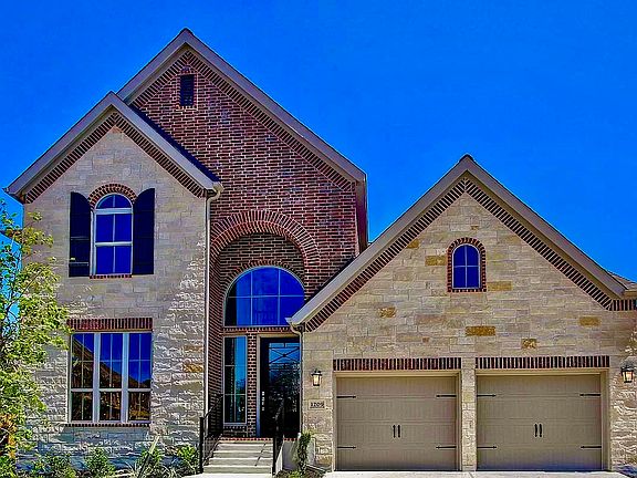 Closer view. 2 car garage, plus additional space for 2 cars in the driveway