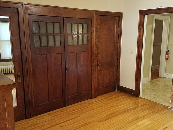DR closets, coat closet with mirror. Doorway to kitchen and hallway.