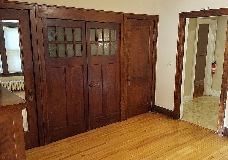 DR closets, coat closet with mirror. Doorway to kitchen and hallway.