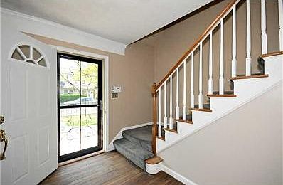 Entry. Beautiful entry, wood flooring, newer paint...