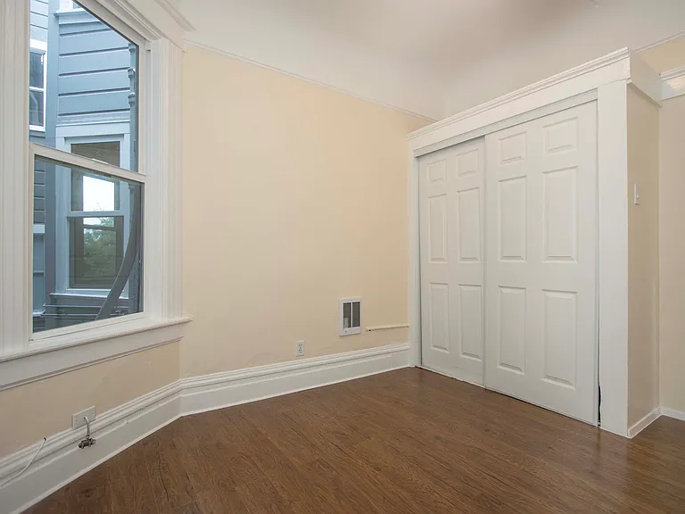 Another view of the second bedroom showing closet; entry door (not pictured) is on the far right