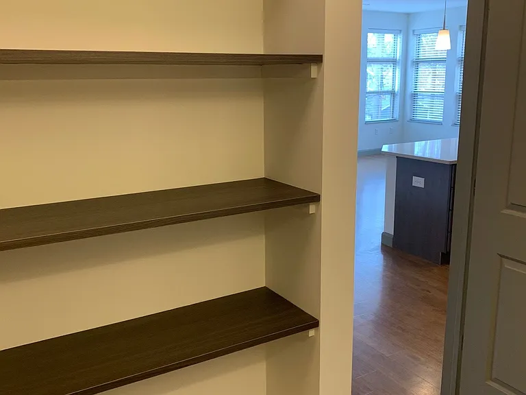 bathroom 2 with built-in shelving