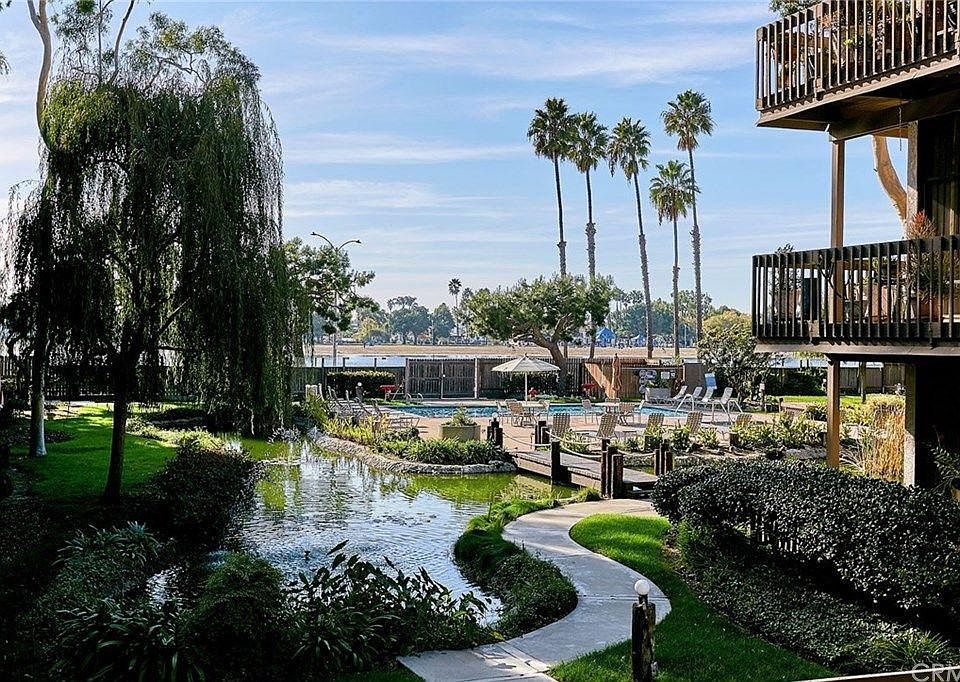 The pool area outside your condo is very well landscaped with lush foliage.