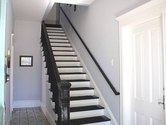 Stairway from entryway to private upstairs studio apartment.