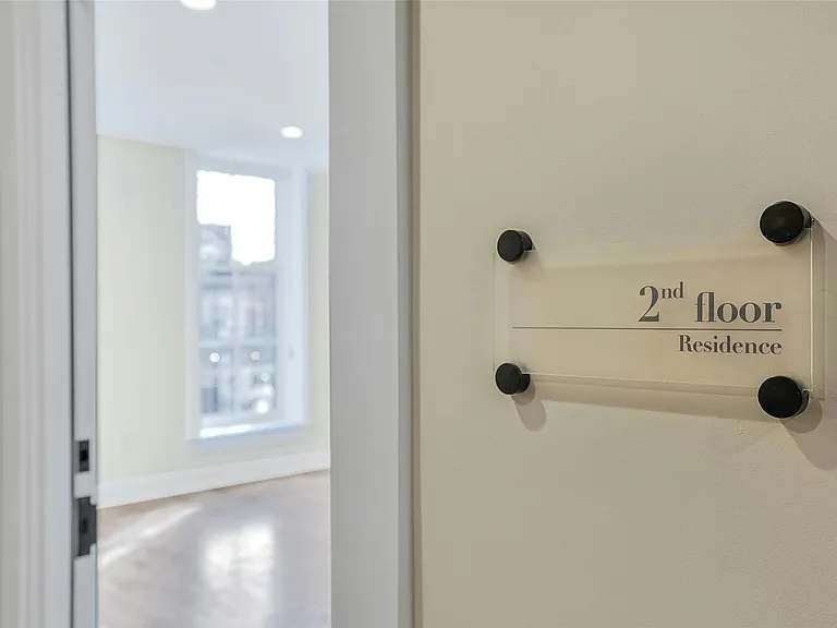Entry and Door: As you enter, you are greeted with a light-filled living space.