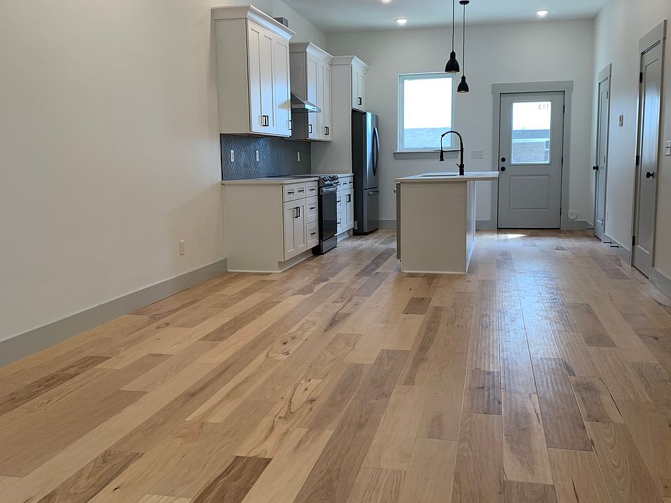 Kitchen and dining area viewed from living room area