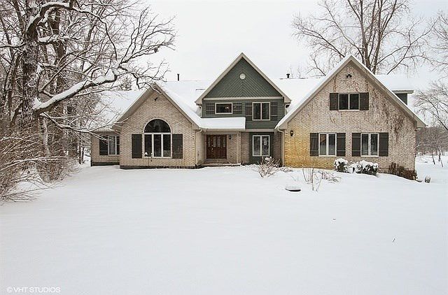 Welcome Home - Like a North woods retreat just minutes to town, train & Prairie Ridge High! A unique opportunity offering flexible floor plan to meet your needs now & in the future on a very private 2.4 Acre lot!