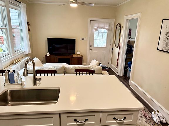 Kitchen with new cabinets, countertops, appliances and fixtures. Looking into the Living Room