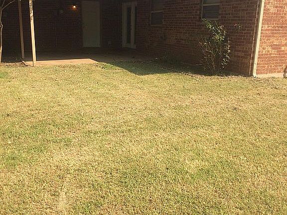 Back view showing covered patio.