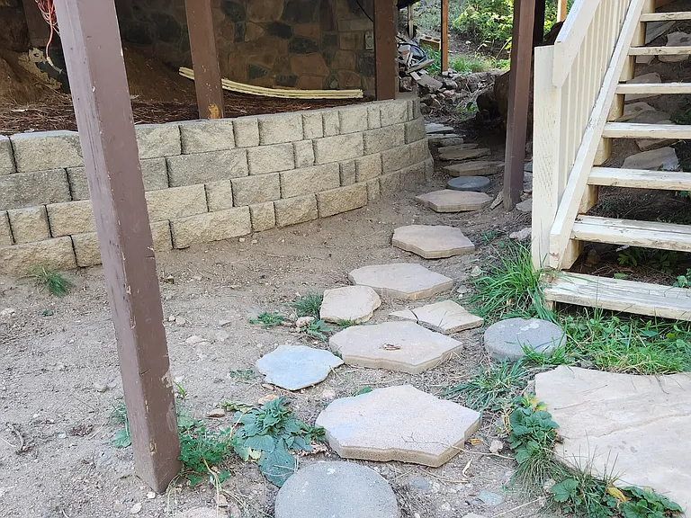 Entry to basement on left and stairs to main floor on right,