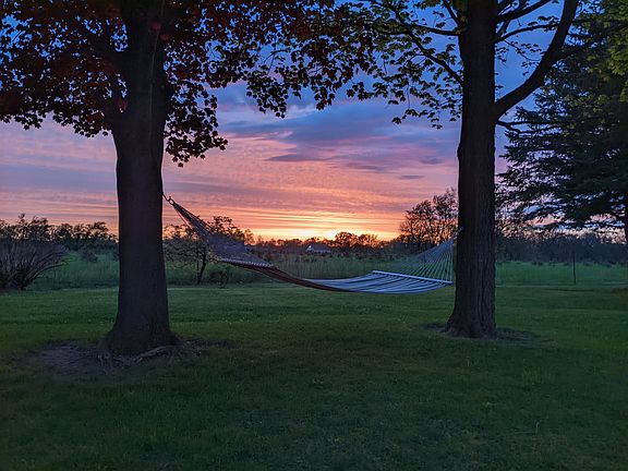 This is a serene spot to rest. Hammock hooks are provided, but not the hammock.