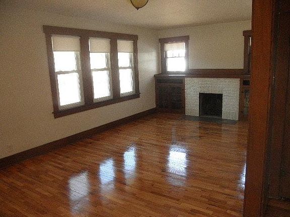 Wood burning fireplace with built in bookcases