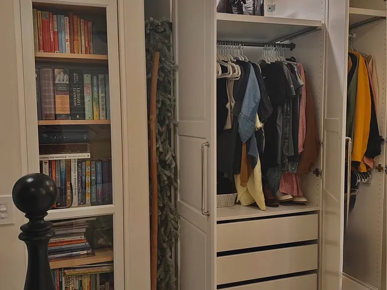 Fully custom closet tree with easy to open drawer, slides, and shoe slides, as well as built-in lighting.