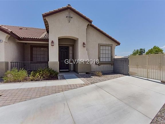 Front Porch and drive way  that goes beyond the gate