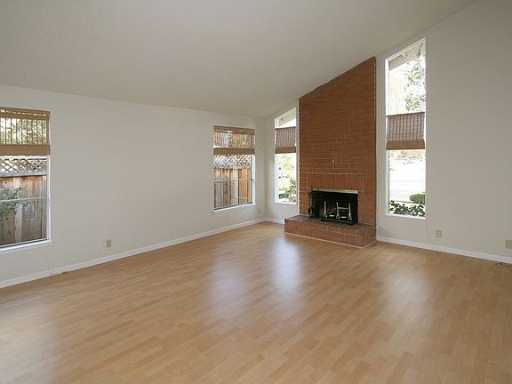 Living Room with fireplace and lots of natural light