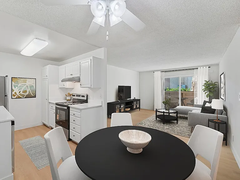 Renovated Package I kitchen, living, and dining area with hard surface flooring
