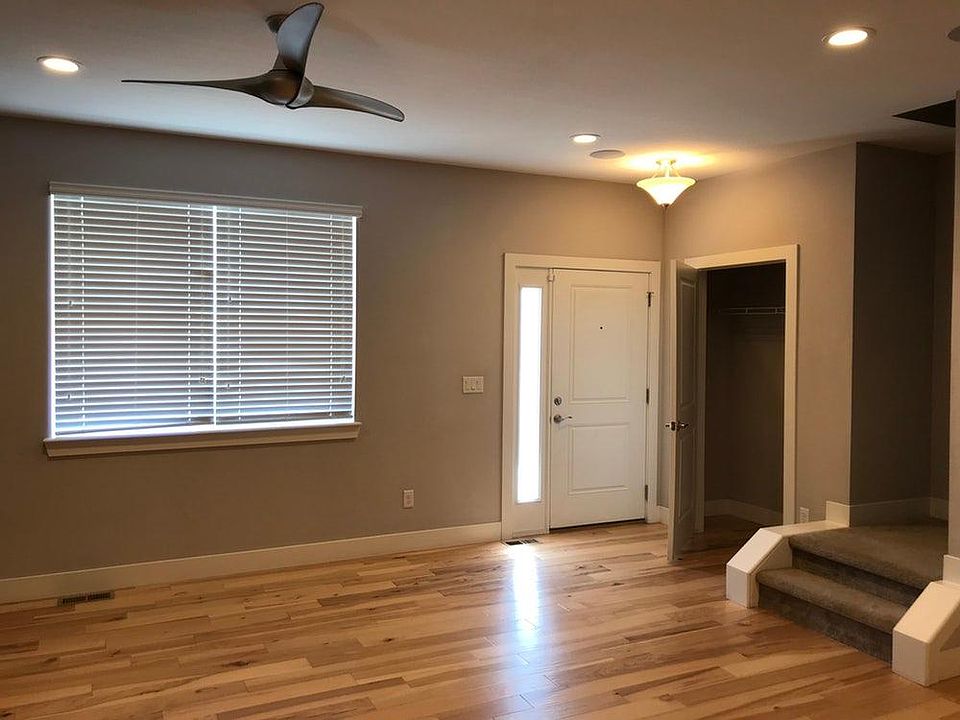 Front Door, coat closet and stairwell.
