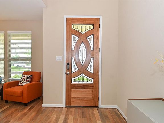 Enter this home through the custom lead glass front door.