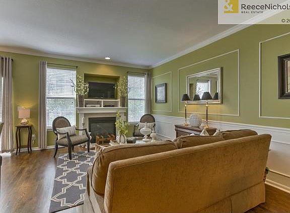 Windows galore! Beautiful fireplace and entertaining space!