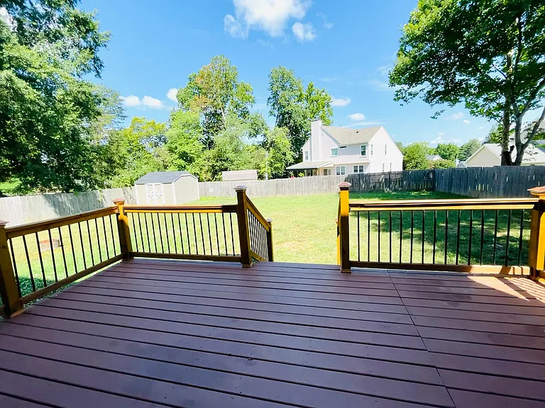Fenced backyard with additional storage