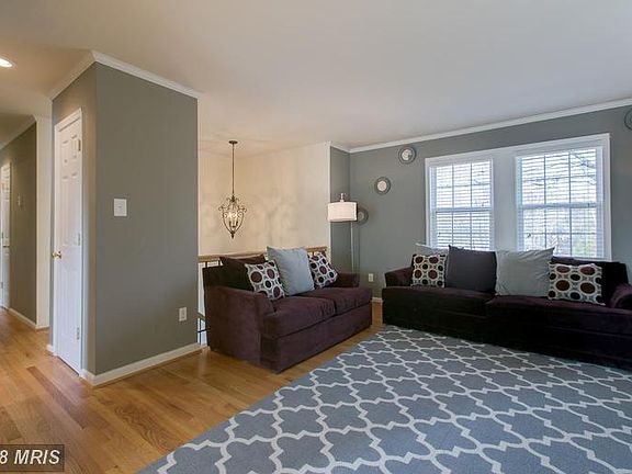 Living Room with Large Window and Hardwood Floors