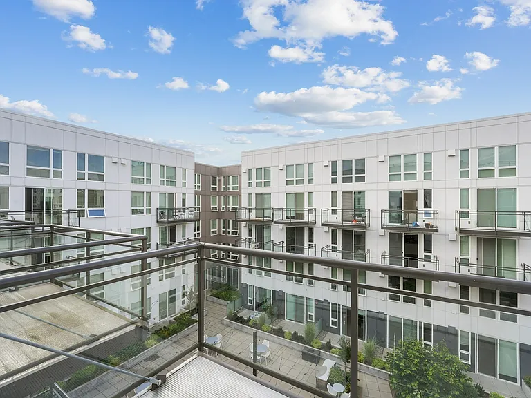 Enjoy serene courtyard views from your private balcony.