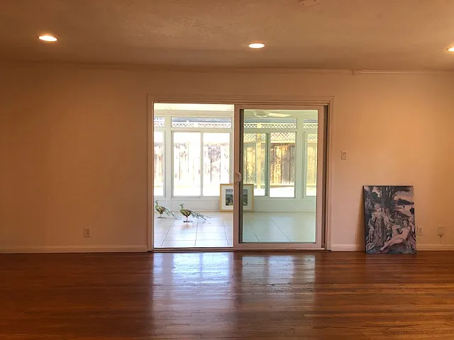 Pleasant living room leading to an attached sun room (professional built with permits and licensed builders)