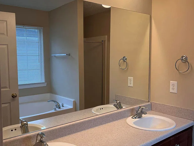 Master bathroom with double vanity and plenty of light