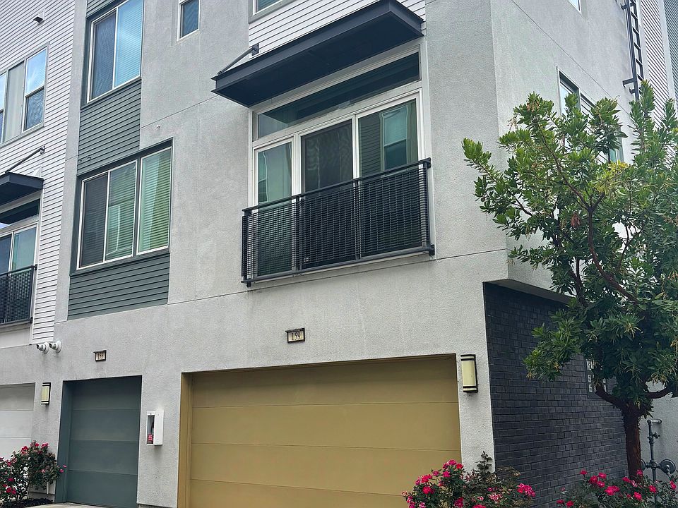 Exterior of house with 2 car garage.