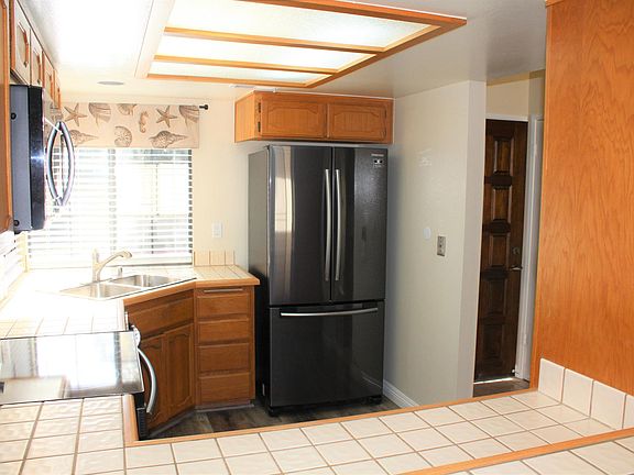 New Samsung appliances in kitchen... Electric range, microwave, dishwasher & refrigerator. New sink and faucet.